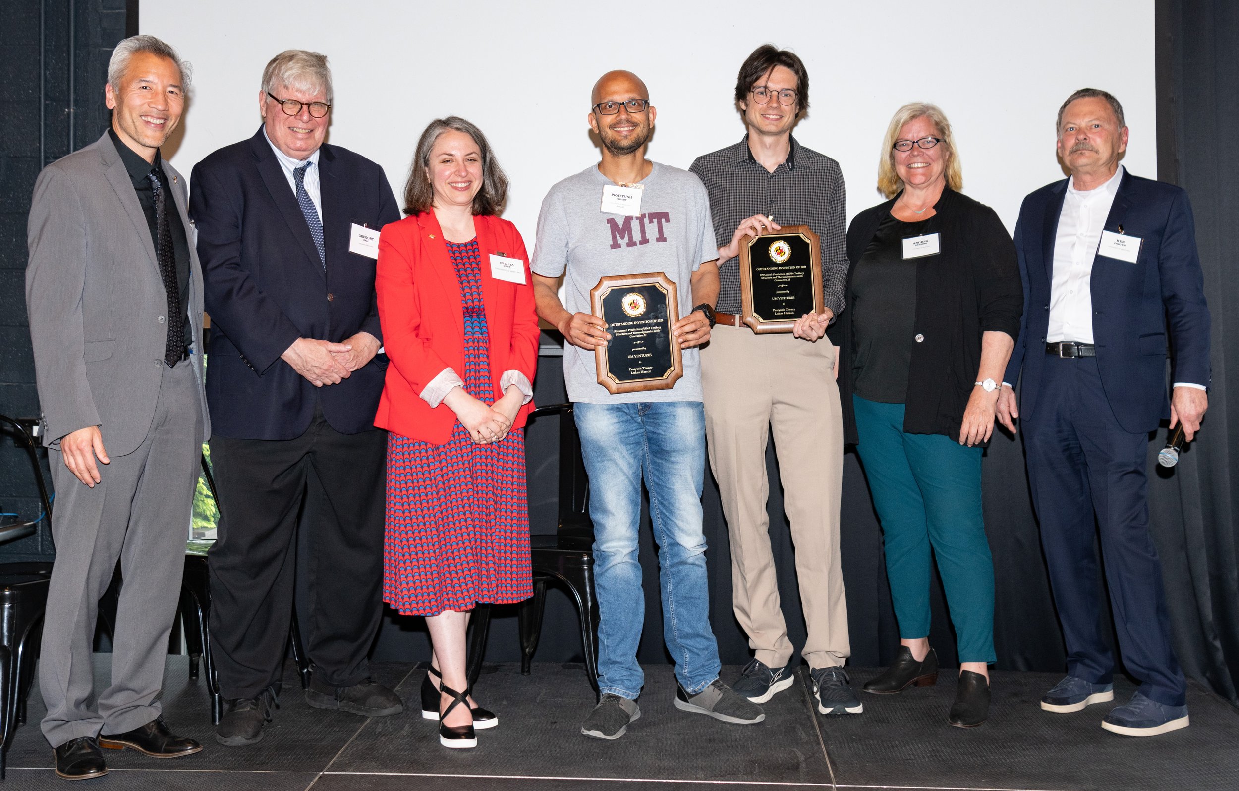 Pratyush Tiwary and Lukas Herron receive the Life Sciences Invention of the Year Award