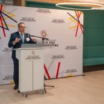 Speaker at the UM-IHC second anniversary ribbon cutting ceremony