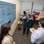 Attendees at the UM-IHC second anniversary ribbon cutting ceremony