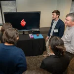 Attendees at the UM-IHC second anniversary ribbon cutting ceremony