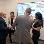 Attendees at the UM-IHC second anniversary ribbon cutting ceremony