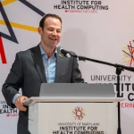 Speaker at the UM-IHC second anniversary ribbon cutting ceremony